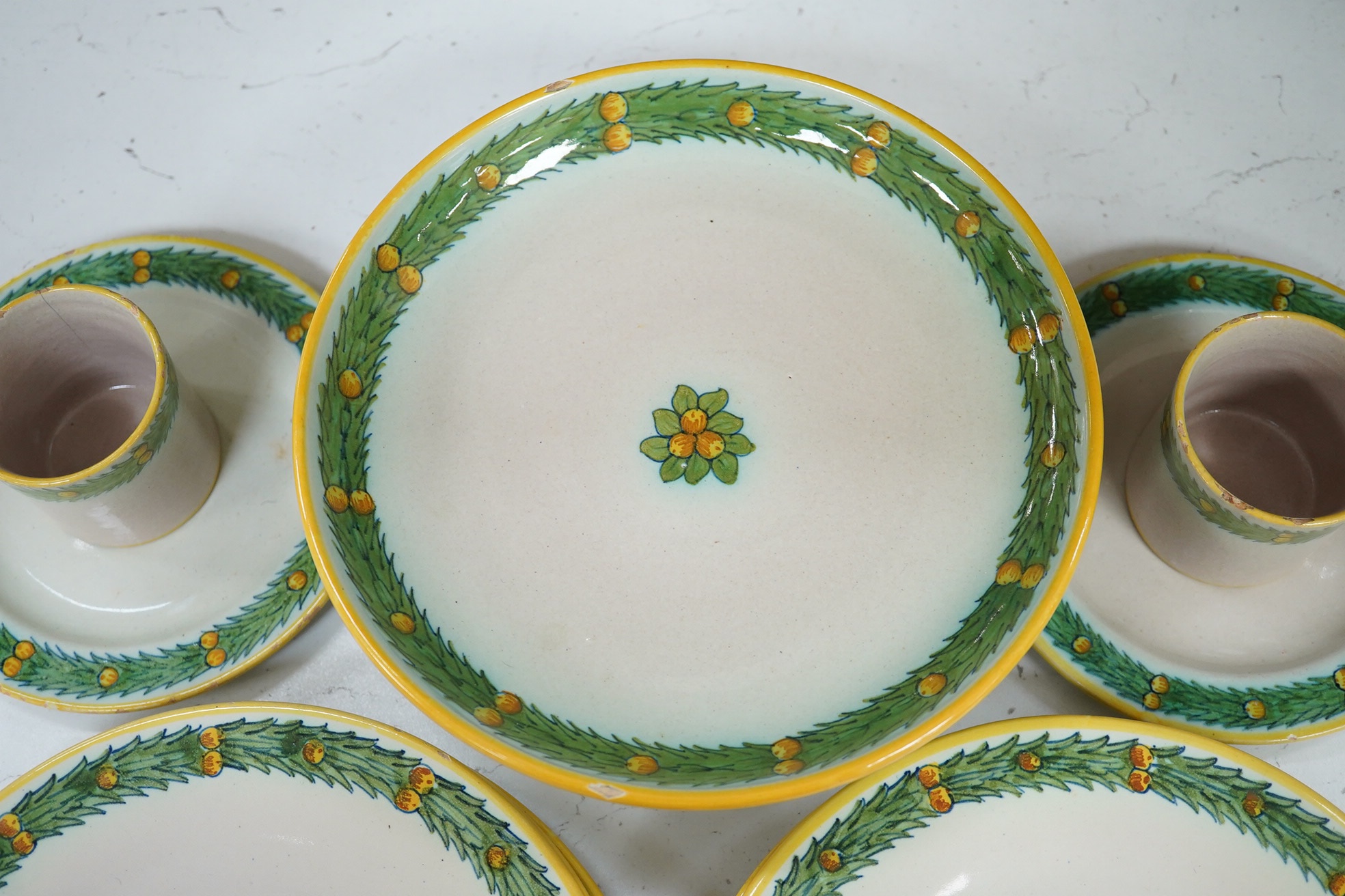 A Cantagalli part breakfast set, comport 20cm diameter. Condition - two cups chipped and cracked. Some small manufacturing faults in the glaze on some plates and minor chip to base comport.